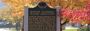 Michigan Historic Site lawn marker noting the 1920 founding of the Michigan Automotive Trade Association.